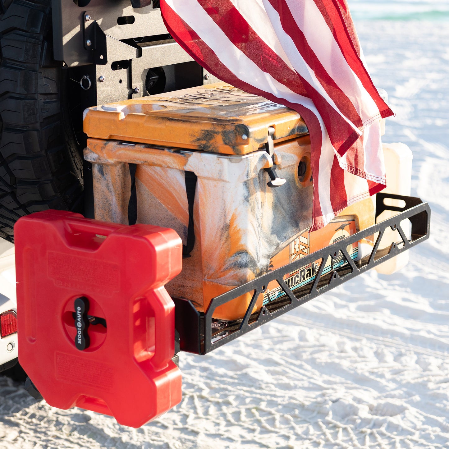 Cargo rack and cargo carrier with RotopaX fuel mounts carrying cooler on beach