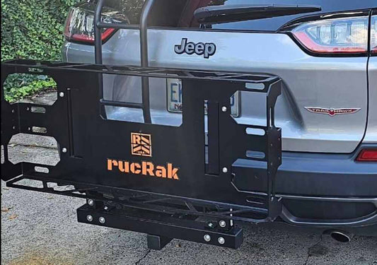 SUV equipped with a rucRak aluminum cargo carrier demonstrating lightweight design, corrosion resistance, and rear vehicle access
