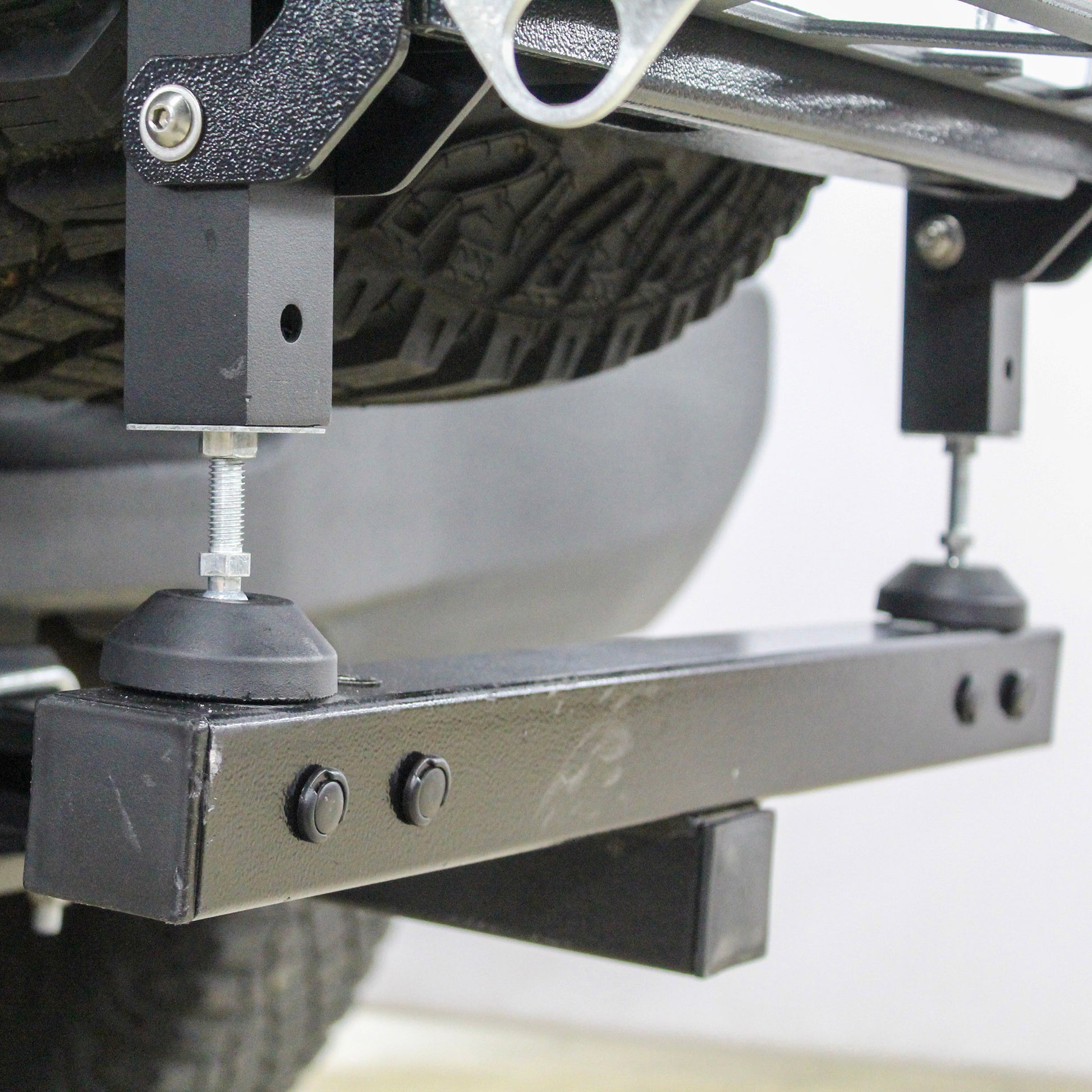 Close-up of a vehicle suspension system with a blurred background