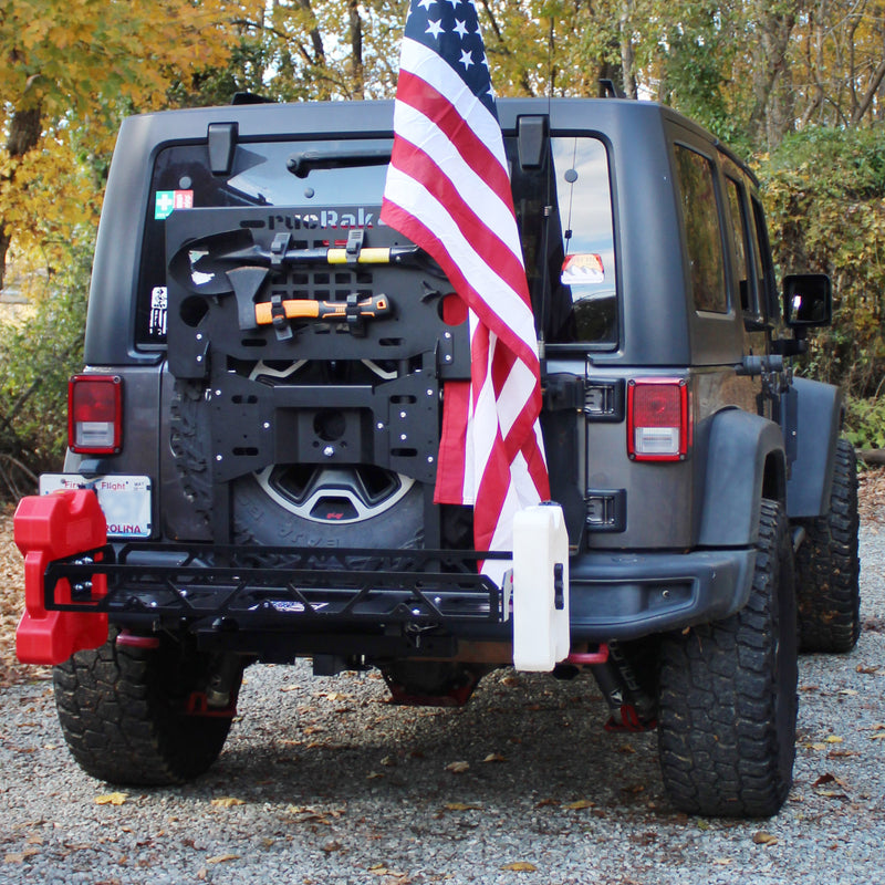 Gray Jeep with cargo carrier with American flag 
